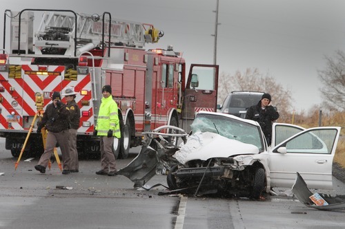 Rick Egan   |  The Salt Lake Tribune

Police and firefighters from Unified Fire, investigate a four car accident on highway 201 in Magna, Monday, December 20, 2010