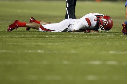 Chris Detrick  |  The Salt Lake Tribune 
Utah Utes quarterback Terrance Cain #7 remains on the ground after fumbling the ball during the second half of the Maaco Bowl at Sam Boyd Stadium Wednesday December 22, 2010.   Boise State won the game 26-3.