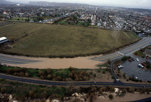 Rick Egan   |  The Salt Lake Tribune

A road is closed due to flooding, in Saint George, Tuesday, December 21, 2010