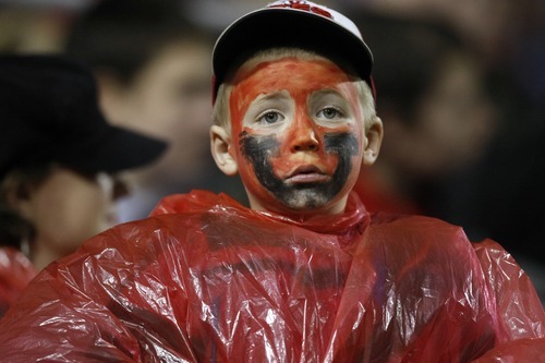 Chris Detrick  |  The Salt Lake Tribune 
A young Utah fan watches during the first half of the Maaco Bowl at Sam Boyd Stadium Wednesday December 22, 2010.   Boise State is winning the game 16-3.
