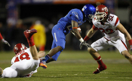 Chris Detrick  |  The Salt Lake Tribune 
Utah Utes linebacker Chad Manis #18 and Utah Utes linebacker Chaz Walker #32 tackle Boise State Broncos running back Jeremy Avery #27 during the first half of the Maaco Bowl at Sam Boyd Stadium Wednesday December 22, 2010.   Boise State won the game 26-3.