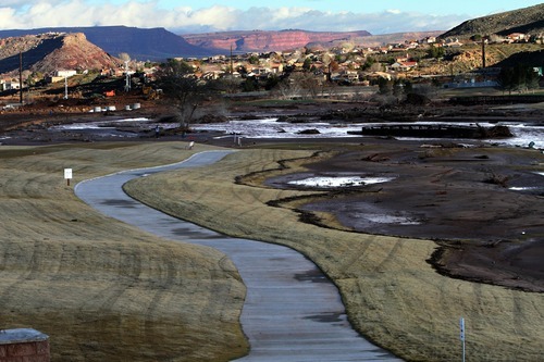 Rick Egan   |  The Salt Lake Tribune

Mud covers a portion of the Southgate golf club in Saint George , Utah, Thursday, December 23, 2010.   Flood waters damaged four holes and totally destroyed the 9th fairway.