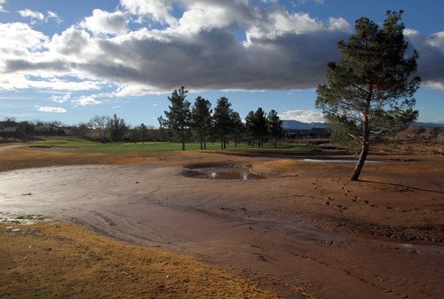 Rick Egan   |  The Salt Lake Tribune

Mud covers a portion of the Southgate golf club in Saint George , Utah, Thursday, December 23, 2010.   Flood waters damaged four holes and totally destroyed the 9th fairway.