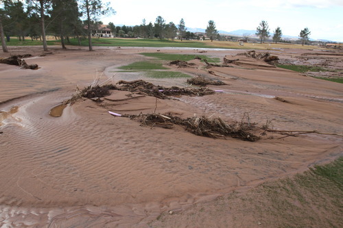 Rick Egan   |  The Salt Lake Tribune

Mud and debris covers the fairway of the 2nd hole at the Southgate golf club in Saint George , Utah, Thursday, December 23, 2010.   Flood waters damaged four holes and totally destroyed the 9th fairway.