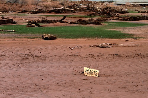 Rick Egan   |  The Salt Lake Tribune

Mud covers the fairway of the 9th hole at the Southgate golf club in Saint George , Utah, Thursday, December 23, 2010.   Flood waters damaged four holes and totally destroyed the 9th fairway.