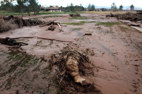 Rick Egan   |  The Salt Lake Tribune

Mud covers the fairway of the 9th hole at the Southgate golf club in Saint George , Utah, Thursday, December 23, 2010.   Flood waters damaged four holes and totally destroyed the 9th fairway.
