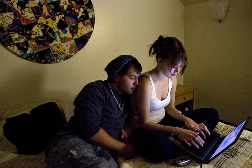 Djamila Grossman  |  The Salt Lake Tribune

Daniel Mancuso and his girlfriend Shyanne Jensen work on the computer in their room at the Ronald McDonald House in Salt Lake City, Monday, Dec. 20, 2010. The couple's daughter Alicen Taylor Mancuso was born on Nov. 19 in Bozeman, Mont., with congenital diaphragmatic hernia and had to be flown to Salt Lake City to undergo surgery.