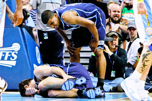 Chris Detrick | The Salt Lake Tribune
Utah Jazz's Mehmet Okur remains on the ground as Utah Jazz's Ronnie Price checks on him during the first half of Game 1 in the first-round NBA playoff series at the Pepsi Center Saturday, April 17, 2010.
