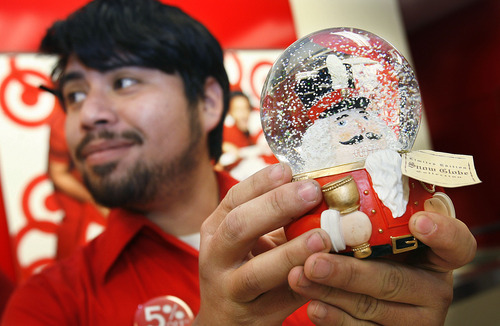 Scott Sommerdorf  l  The Salt Lake Tribune
Someone decided to return this lovely snow globe held by Target customer service associate Armando Mata the day after Christmas at Target in Salt Lake City, Sunday, Dec. 26, 2010.