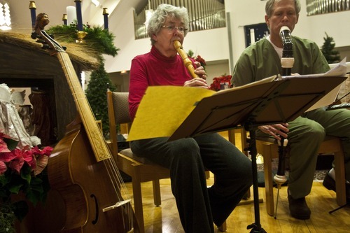 Chris Detrick  |  The Salt Lake Tribune 
Members of the Sine Nomine Consort (L-R) Mary Johnson, playing the recorder, and Herald Clark, playing the recorder perform during a rehearsal at All Saints Episcopal Church in Salt Lake City Tuesday December 28, 2010.  The Sine Nomine Consort is an ensemble that performs Renaissance and Baroque music on period instruments, including recorders, viols and harpsichord, as well as vocal music.