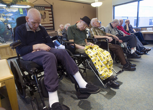 Al Hartmann  |  The Salt Lake Tribune 
Residents at the Utah State Veterans Nursing Home in Salt Lake City take a post-breakfast morning nap as others watch 