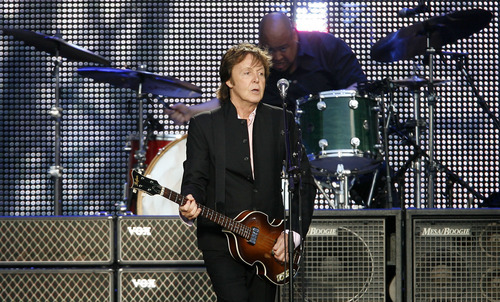 Steve Griffin  |  The Salt Lake Tribune

 Paul McCartney steps away from the microphone as he plays his guitar during his concert at Rio Tinto Stadium in Sandy on Tuesday,  July 13, 2010.