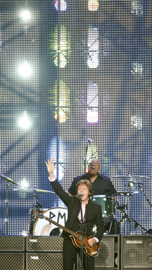 Steve Griffin  |  The Salt Lake Tribune

 Paul McCartney waves to the crowd as he sings during his concert at Rio Tinto Stadium in Sandy Tuesday, July 13, 2010.