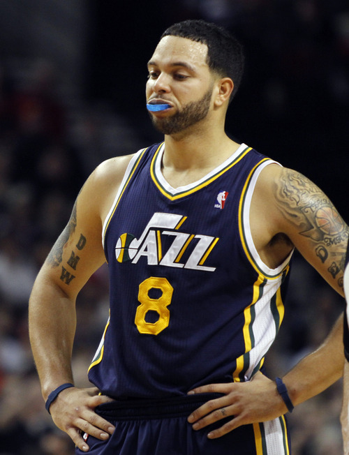 Utah Jazz guard Deron Williams stands at half court late in the fourth quarter of the 100-89 loss  in their NBA basketball game against the Portland Trail Blazers in Portland, Ore., Thursday, Dec.30, 2010.  Williams led the Jazz inscoring with 19 points.(AP Photo/Don Ryan)