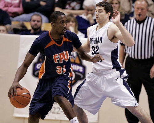 Djamila Grossman  |  The Salt Lake Tribune

Brigham Young University's Jimmer Fredette, 32, guards Pacific University's Jerante Morgan, 32, during the second half of a game in Provo, Saturday, Jan. 1, 2011. BYU won the game.