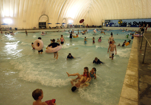 Rick Egan   |  The Salt Lake Tribune

Swimmers float in tubes on the waves at Layton Surf-N-Swim Dec. 30. Layton Surf-N-Swim, has been around for at least 20 years and features a 25-foot lap area as well as a wave area where it goes from zero depth at one end to 8 feet at the other. Waves run for 10 minutes, every 20 minutes.