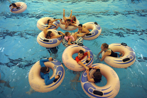 Rick Egan   |  The Salt Lake Tribune

Swimmers float in tubes on the waves at Layton Surf-N-Swim Dec. 30.