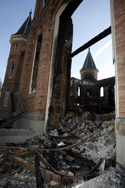 Francisco Kjolseth  |  The Salt Lake Tribune

Only a shell remains as crews begin to remove debris from the historic downtown Provo Tabernacle following last week's fire that gutted the beloved building.