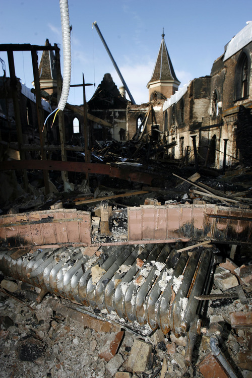Francisco Kjolseth  |  The Salt Lake Tribune

Only a shell remains as crews begin to remove debris Tuesday from the historic Provo Tabernacle following last week's fire that gutted the beloved building.