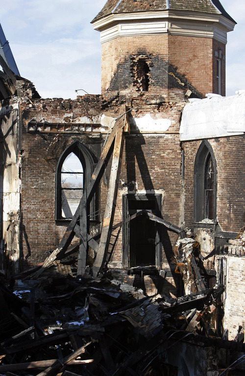Francisco Kjolseth  |  The Salt Lake Tribune
Crews begin to remove debris Tuesday from the historic Provo Tabernacle following last week's fire that gutted the beloved building.