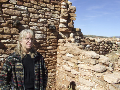 Brandon Loomis  |  The Salt Lake Tribune
Edge of the Cedars State Park Museum Director Teri Paul stands in an excavated pueblo left behind by ancient residents of the area. The Blanding area is thick with buried archaeological sites because of ready food and water sources and a broad horizon to view an enemy's approach, Paul says.