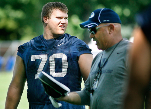Scott Sommerdorf  l  The Salt Lake Tribune
BYU offensive tackle Matt Reynolds, (70) at practice in Provo on Monday, August 9, 2010. At right is offensive line coach Mark Weber.
