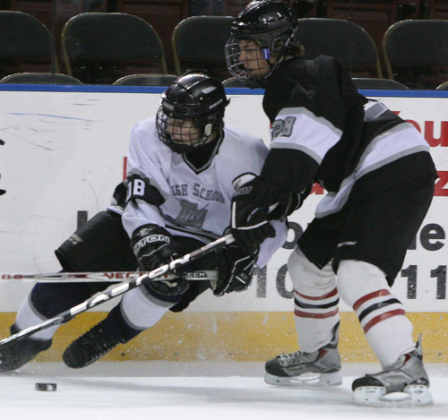 Leah Hogsten  |  The Salt Lake Tribune
White jersey #16 Kevin Delvie of Juan Diego battles Black jersey #28. The 2010-2011 Utah High School Hockey All-Star Game. Top hockey players from high schools throughout the state will face off in a North vs. South game. (North includes Davis County, Salt Lake City schools, Murray schools.... South includes South Jordan, Utah County, Sandy, Riverton, Park City schools).Saturday, January 1, 2011, in West Valley.