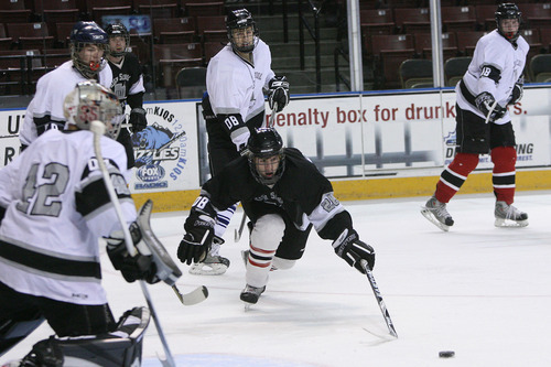 Leah Hogsten  |  The Salt Lake Tribune
 Black Jersey #28 fights for the puck.  The 2010-2011 Utah High School Hockey All-Star Game. Top hockey players from high schools throughout the state will face off in a North vs. South game. (North includes Davis County, Salt Lake City schools, Murray schools.... South includes South Jordan, Utah County, Sandy, Riverton, Park City schools).Saturday, January 1, 2011, in West Valley.