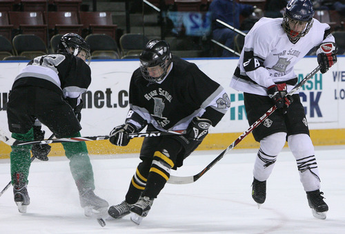 Leah Hogsten  |  The Salt Lake Tribune
l-r Craig Peterson of Ogden, #12, watches as teammate Cole Mitchell of Cottonwood #20 drives past Skyler Pierce #4 of Maple Mountain.   The 2010-2011 Utah High School Hockey All-Star Game. Top hockey players from high schools throughout the state will face off in a North vs. South game. (North includes Davis County, Salt Lake City schools, Murray schools.... South includes South Jordan, Utah County, Sandy, Riverton, Park City schools).Saturday, January 1, 2011, in West Valley.