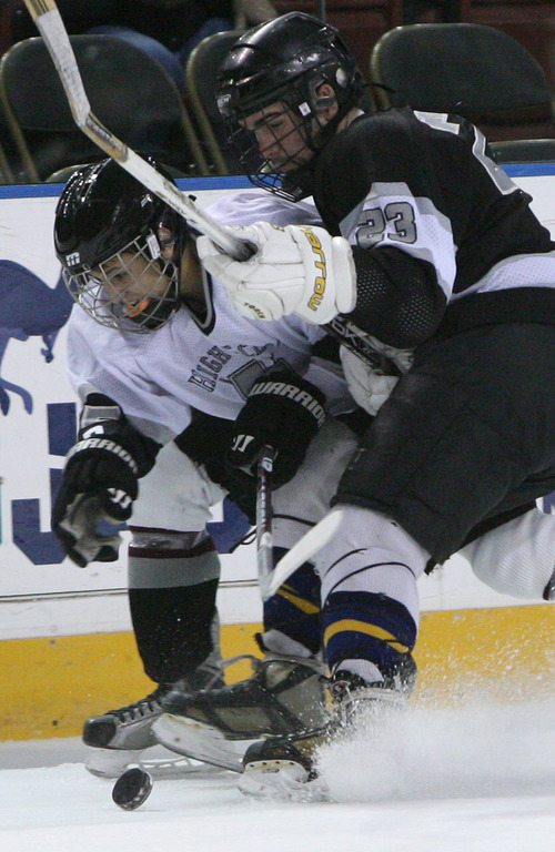 Leah Hogsten  |  The Salt Lake Tribune
 l-r  White jersey Matt Psaras #35 Jordan battles Black jersey Sam Jarvis #23 of Sky View. The 2010-2011 Utah High School Hockey All-Star Game. Top hockey players from high schools throughout the state will face off in a North vs. South game. (North includes Davis County, Salt Lake City schools, Murray schools.... South includes South Jordan, Utah County, Sandy, Riverton, Park City schools).Saturday, January 1, 2011, in West Valley.