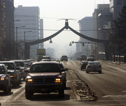 Al Hartmann  |  The Salt Lake Tribune 
View looking down State Street at the Eagle Gate Wednesday afternoon is limiited to a couple blocks due to trapped polluted air.  The Utah Dept. of Environmental Quality issued a red alert along the Wasatch Front on Wednesday.