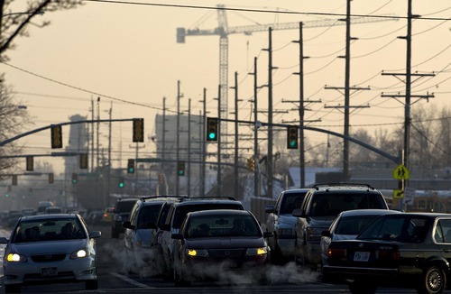 Djamila Grossman  |  The Salt Lake Tribune

View of cars in traffic in Provo, with the fog of the inversion in the background, Friday, Jan. 7, 2011.