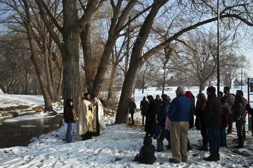 Chris Detrick  |  The Salt Lake Tribune 
Father Elias Koucos, of the Prophet Elias Greek Orthodox Church, right, and Father Justin Havens, of the Sts. Peter and Paul Orthodox Christian Church, bless the waters during a ceremony at Sugar House Park Thursday January 6, 2011.