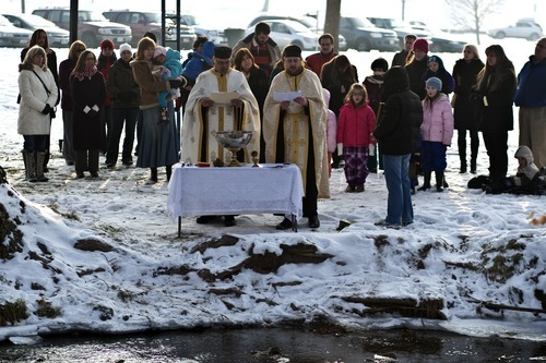 Chris Detrick  |  The Salt Lake Tribune 
Father Elias Koucos, of the Prophet Elias Greek Orthodox Church, left, and Father Justin Havens, of the Sts. Peter and Paul Orthodox Christian Church, bless the waters during a ceremony at Sugar House Park Thursday January 6, 2011.