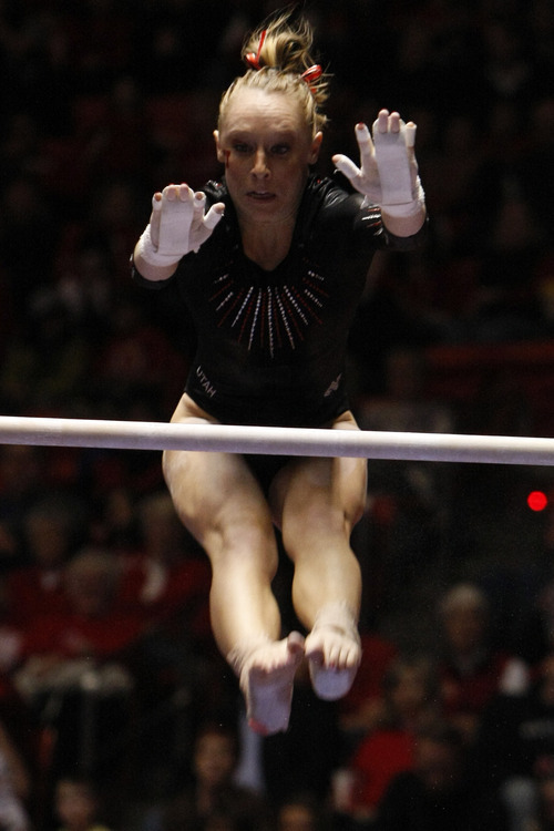 Chris Detrick  |  The Salt Lake Tribune 
Utah's Jacquelyn Johnson competes on the bars during the gymnastics meet against UCLA the Huntsman Center Friday January 7, 2011. Utah won 195.700 - 195.300.