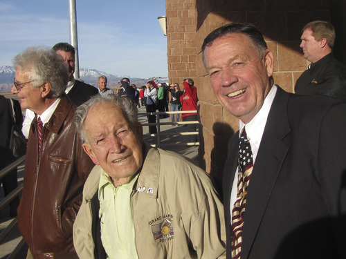 Mark Havnes  |  The Salt Lake Tribune
St. George Mayor Dan McArthur, right, and his father, Eldon, attend the grand opening of the new airport Wednesday. Eldon, 90, instilled a love of flying in his son, so the mayor returned the favor by getting his dad a seat on the airport's inaugural commercial jet flight.