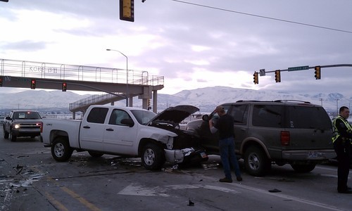 Cimaron Neugebauer | The Salt Lake Tribune
A Ford Explorer, right, in the left-hand turn lane on Bangerter Highway was hit by a truck that hit a car that ran the red light at the intersection of Bangerter and 12600 South on Wednesday.