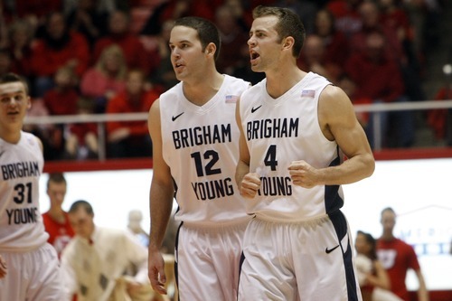 Chris Detrick  |  The Salt Lake Tribune 
Brigham Young Cougars forward Logan Magnusson #12 and Brigham Young Cougars guard Jackson Emery #4 during the game at the Huntsman Center Tuesday January 11, 2011.   BYU won the game 104-79.