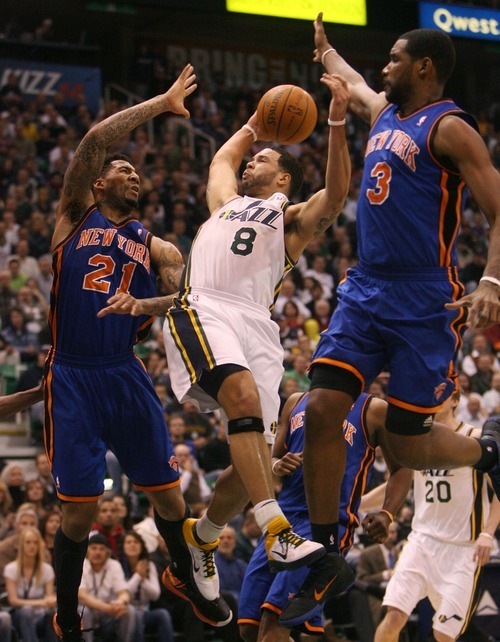 Steve Griffin  |  The Salt Lake Tribune
 
Utah's Deron Williams splits the defense by New York's Wilson Chandler and Shawne Williams as he shoots the ball during the first half of the Jazz versus Knicks basketball game at EnergySolutions Arena in Salt Lake City Wednesday, January 12, 2011.