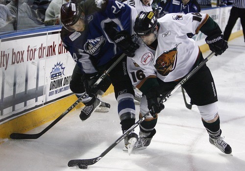 Djamila Grossman  |  The Salt Lake Tribune

The Grizzlies' Tyler Ruegsegger, 16, and Idaho Steelheads' Steve Oleksy, 24, drive the puck across the ice during a game at the Maverik Center in West Valley City, Wednesday, Jan. 12, 2011. Idaho won the game.