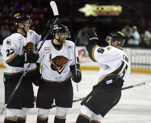 Djamila Grossman  |  The Salt Lake Tribune

The Grizzlies' Matt Clarke, 15, and David Schulz, 22, cheer for Tyler Ruegsegger, 16, who scored the first goal against the Idaho Steelheads during a game at the Maverik Center in West Valley City, Wednesday, Jan. 12, 2011.