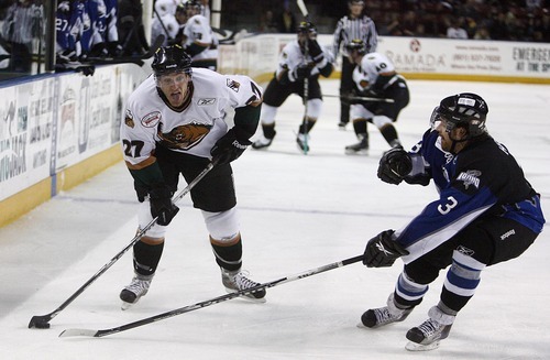 Djamila Grossman  |  The Salt Lake Tribune

The Grizzlies' Brent Gauvreau, 27, and the Idaho Steelheads' Chris Hepp, 3, try to control the puck during a game at the Maverik Center in West Valley City, Wednesday, Jan. 12, 2011. Idaho won the game.