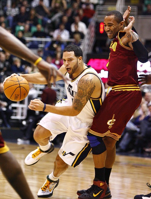 Djamila Grossman  |  The Salt Lake Tribune

The Utah Jazz's Deron Williams, 8, drives past Cleveland's Mo Williams, 2, during a game in Salt Lake City, Friday, Jan. 14, 2011. The Jazz won the game.