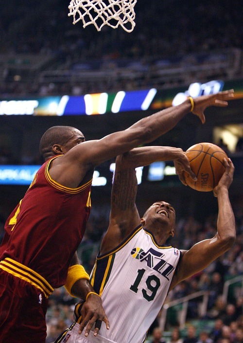 Djamila Grossman  |  The Salt Lake Tribune

The Utah Jazz's Raja Bell, 19, tries to shoot and is defended by Cleveland's Antawn Jamison, 4, during a game in Salt Lake City, Friday, Jan. 14, 2011. The Jazz won the game.