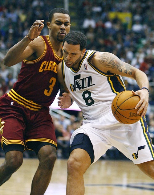 Djamila Grossman  |  The Salt Lake Tribune

The Utah Jazz's Deron Williams, 8, pushes past Cleveland's Ramon Sessions, 3, during a game in Salt Lake City, Friday, Jan. 14, 2011. The Jazz won the game.