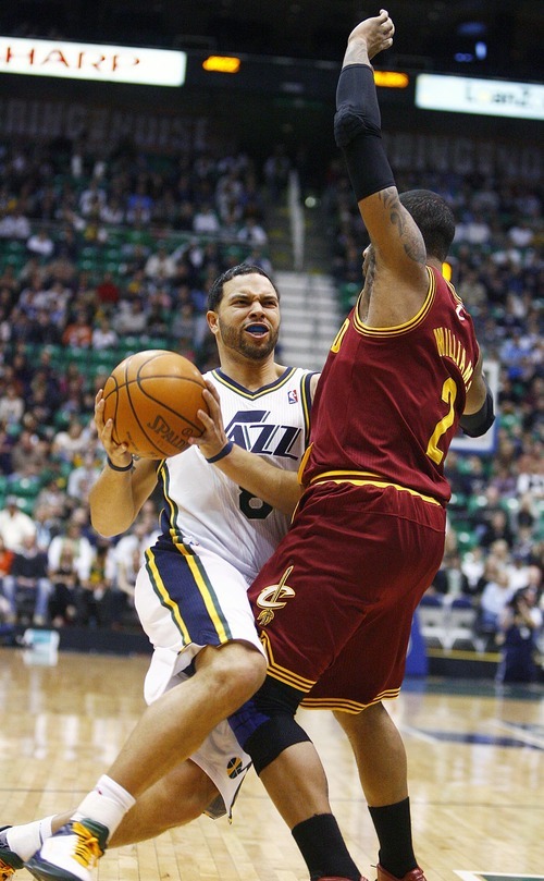 Djamila Grossman  |  The Salt Lake Tribune

The Utah Jazz's Deron Williams, 8, pushes past the Cleveland's Mo Williams, 2, during a game in Salt Lake City, Friday, Jan. 14, 2011.