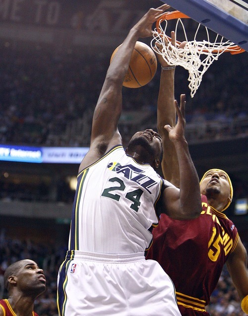 Djamila Grossman  |  The Salt Lake Tribune

The Utah Jazz's Paul Millsap, 24, holds on to the basket after shooting the ball as Cleveland's Jamario Moon, 15, comes up behind him, during a game in Salt Lake City, Friday, Jan. 14, 2011. The Jazz won the game.