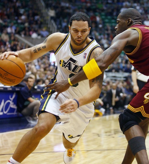 Djamila Grossman  |  The Salt Lake Tribune

The Utah Jazz's Deron Williams, 8, drives past Cleveland's Antawn Jamison, 4, during a game in Salt Lake City, Friday, Jan. 14, 2011. The Jazz won the game.