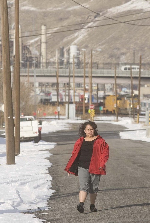 Paul Fraughton  |  The Salt Lake Tribune    
Maria Barajas walks through her neighborhood on her way to meet her daughter at West High School on Monday, Jan. 10, 2011.