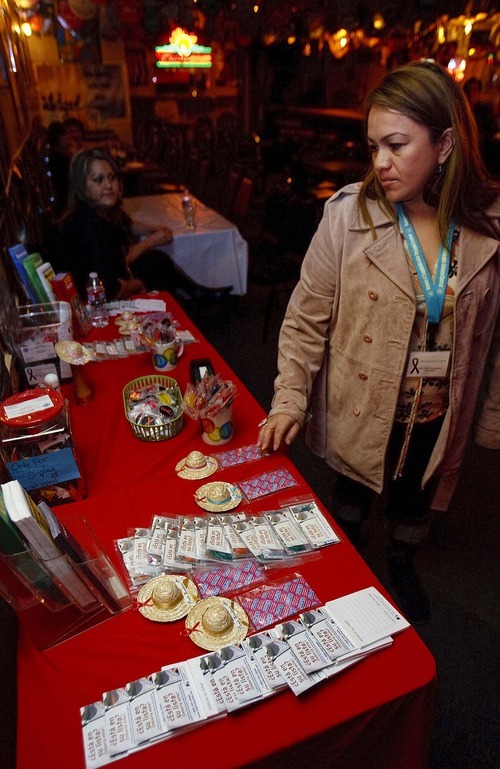 Trent Nelson  |  The Salt Lake Tribune
Natalia Solache, working with the Utah Department of Health, offers free HIV tests and educational materials at the Durango Nightclub in December.
